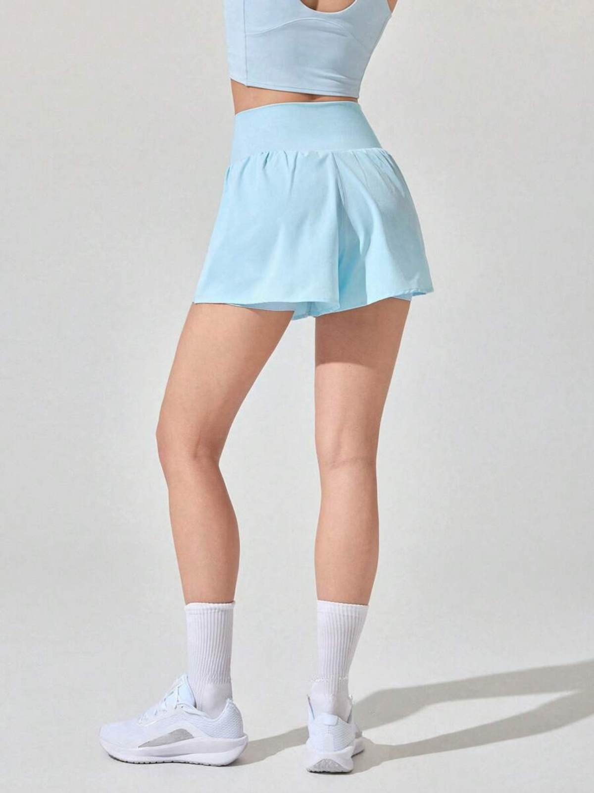 Short de course anti-transpiration, taille mi-haute, poches, séchage rapide